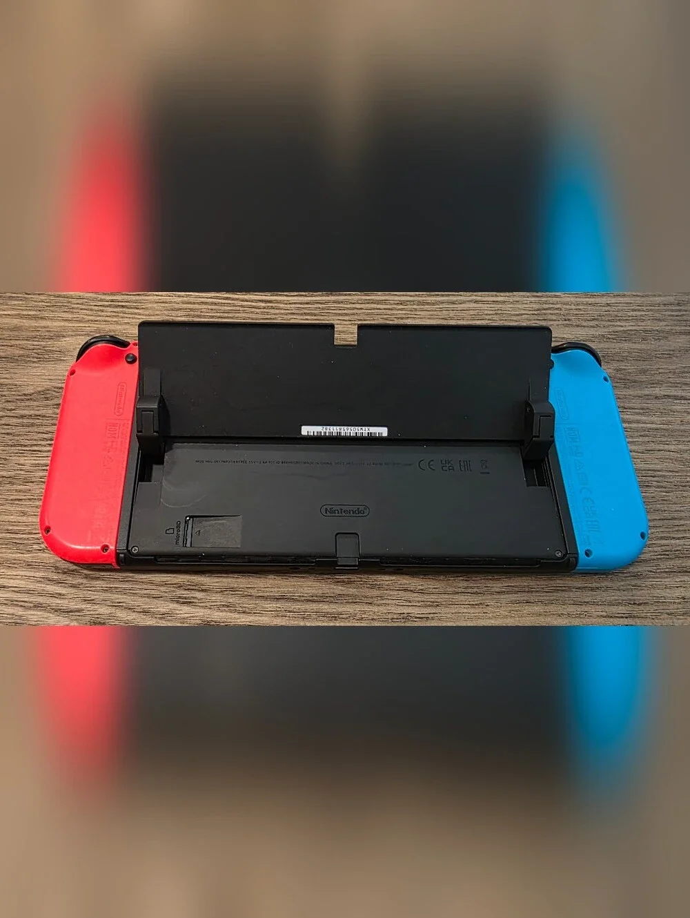 Nintendo Switch OLED - Neon Blue/Neon Red Renewed
